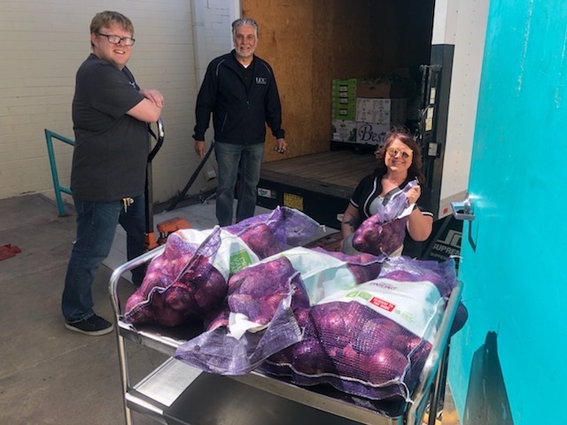 LDC Food and Beverage Team Members Load Food Donations